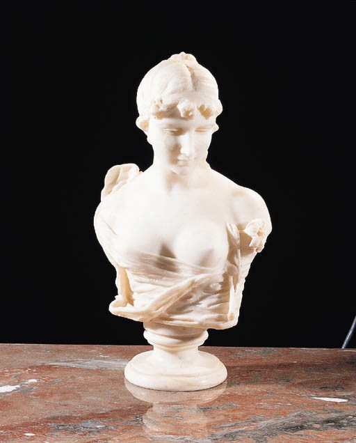 A carved white marble portrait bust of a young girl