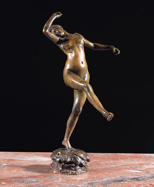 A bronze figure of a dancing girl