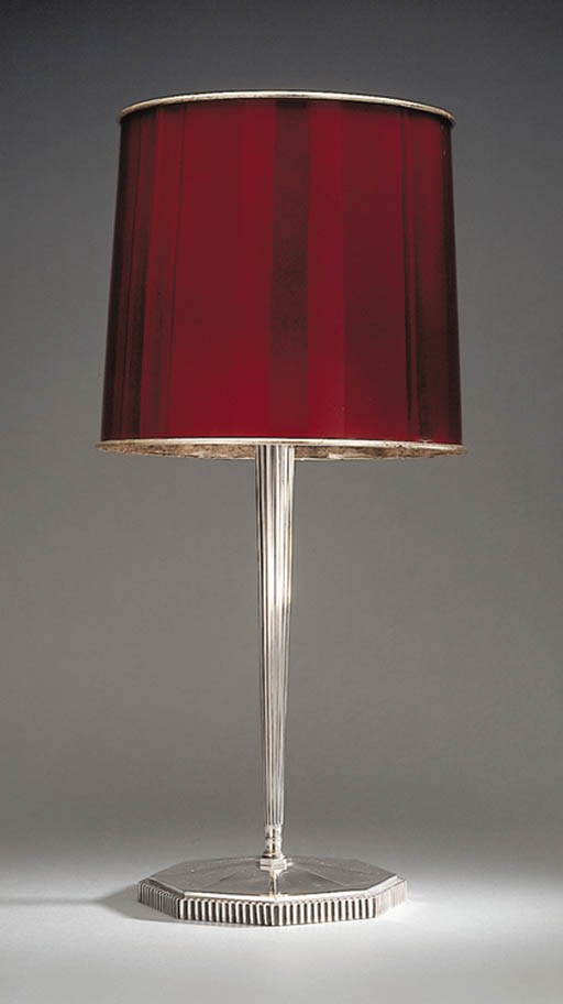 A SILVERED BRONZE AND METAL TABLE LAMP