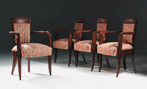 A suite of ten armchairs
