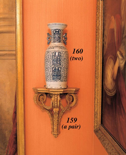 A PAIR OF GILTWOOD AND GILT-COMPOSITION WALL BRACKETS