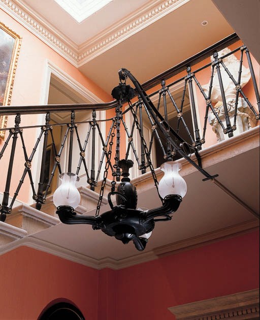 A PAIR OF BRONZED THREE-LIGHT CHANDELIERS