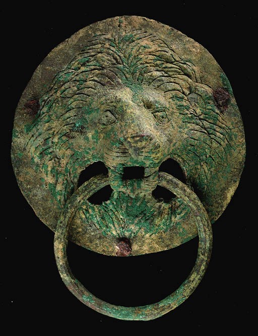 A ROMAN BRONZE LION-HEADED HANDLE