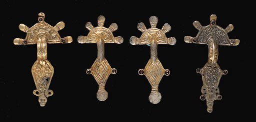 FOUR FRANKISH GILT SILVER BOW BROOCHES