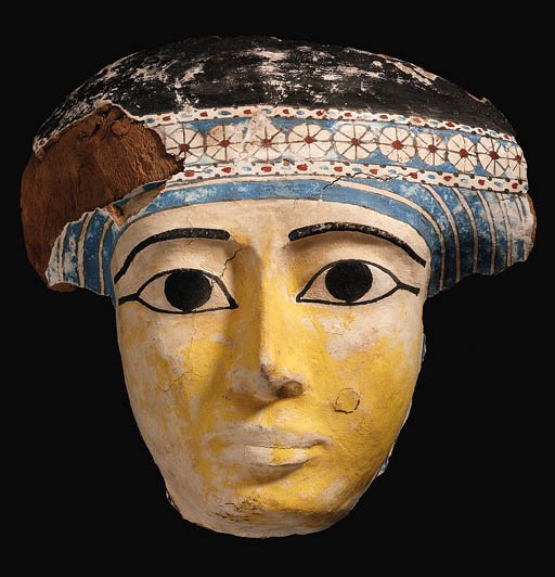 A THIRD INTERMEDIATE PERIOD GESSOED AND PAINTED WOOD MUMMY MASK