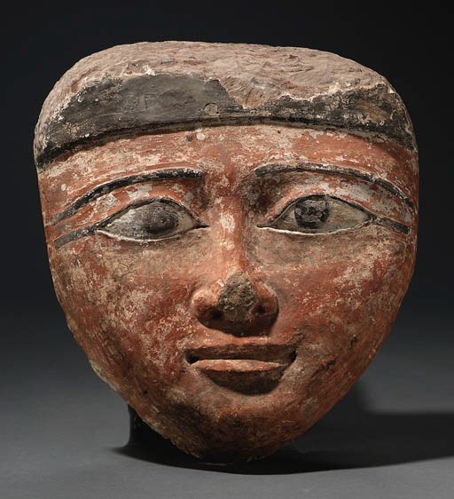 A THIRD INTERMEDIATE PERIOD SANDSTONE MUMMY MASK