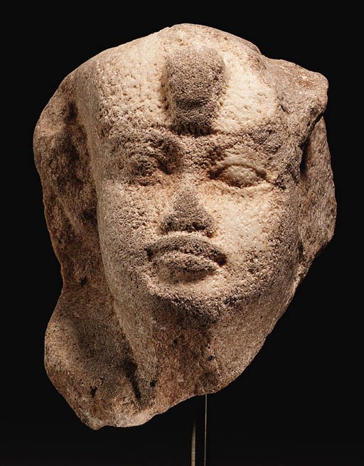 A PTOLEMAIC PERIOD DIORITE HEAD OF A PHAROAH OR DEITY