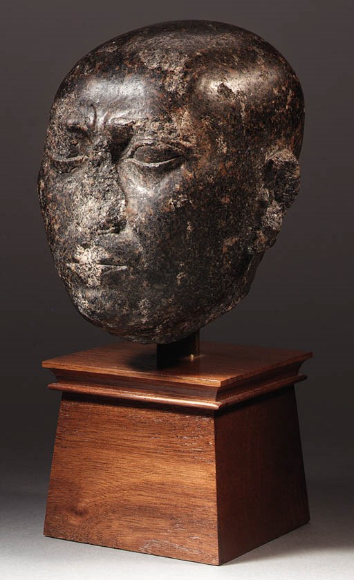 A LATE PERIOD GRANO-DIORITE HEAD OF A MAN