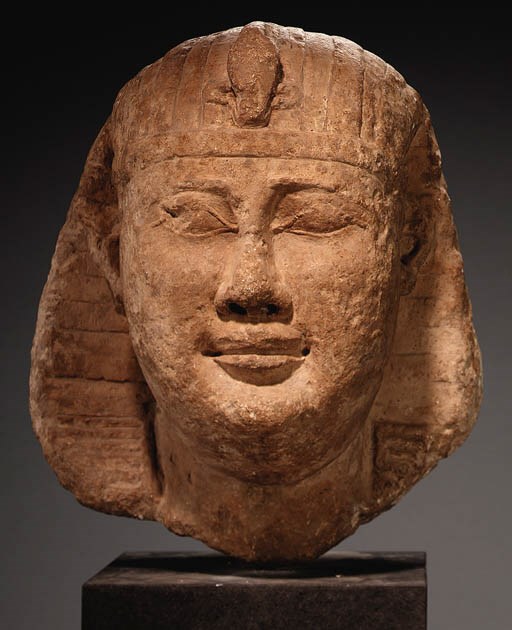 A COLOSSAL LIMESTONE HEAD FROM A ROYAL SPHINX