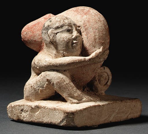 A PAINTED LIMESTONE EROTICON