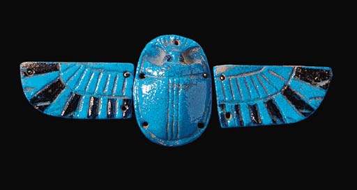 A FAIENCE WINGED SCARAB