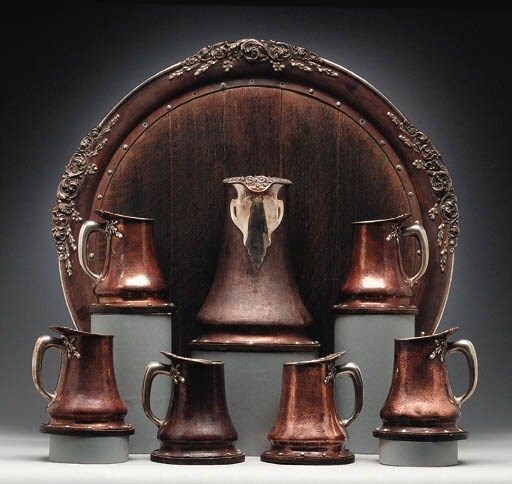 AN EIGHT PIECE MIXED-METALS SILVER AND COPPER BEVERAGE SET