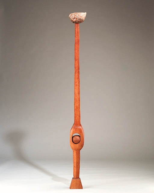 A WALNUT AND COMPOSITION SCULPTURE