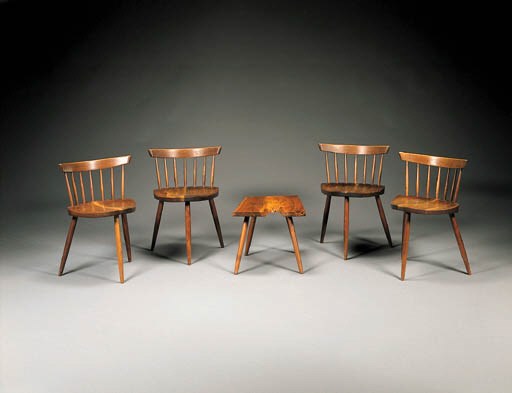 A SET OF FOUR WALNUT 'MIRA' CHAIRS AND AN END TABLE