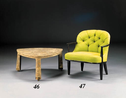 AN UPHOLSTERED EBONIZED WALNUT ARMCHAIR