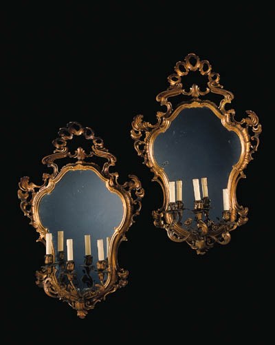 A pair of Italian giltwood three-light girandoles