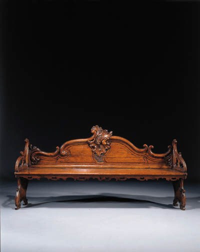 A Dutch stained pine and limewood hall bench