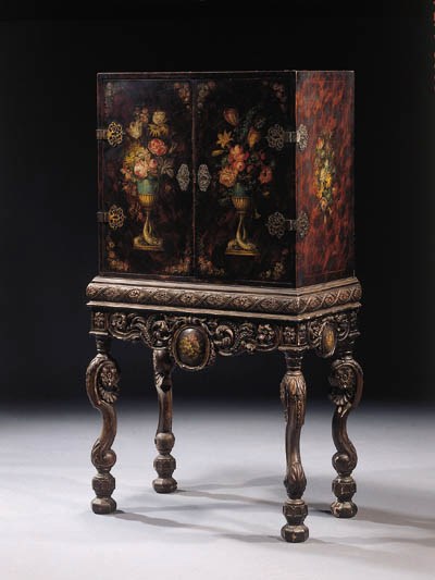 A north european polychrome-decorated and silvered cabinet-on-stand