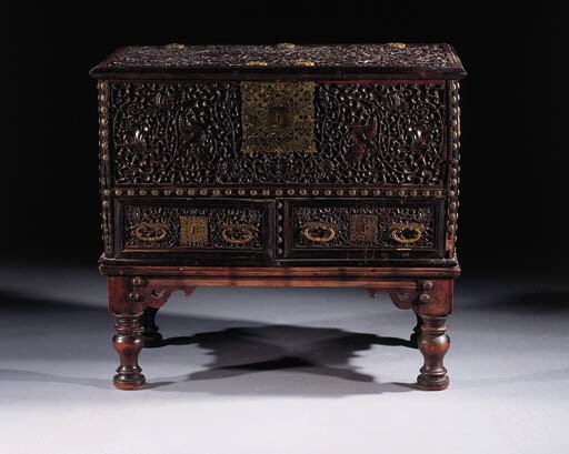 A Dutch colonial brass mounted ebony and ironwood chest on stand