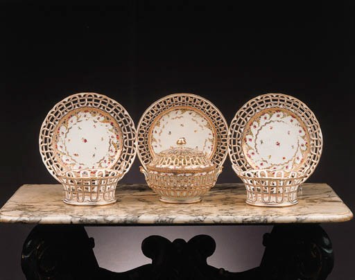 a pair of loosdrecht two-handled fruit baskets and stands; and a loosdrecht nut basket with cover and stand