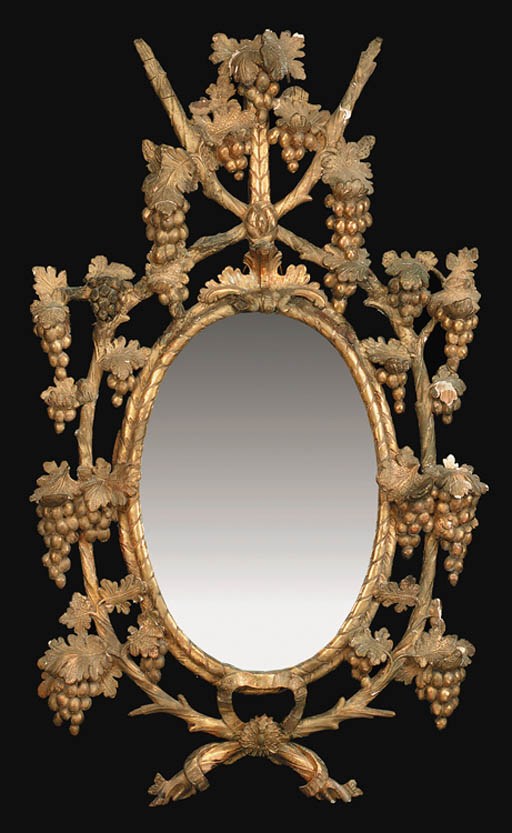 AN IRISH GEORGE III GILTWOOD AND GILT-GESSO OVAL MIRROR