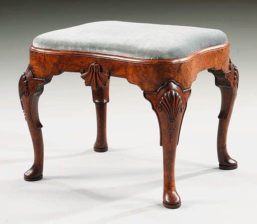 A WALNUT STOOL