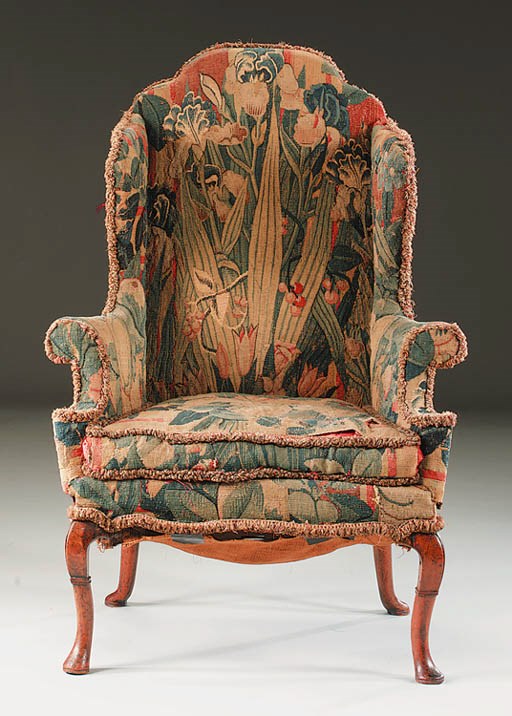A QUEEN ANNE WALNUT WING ARMCHAIR