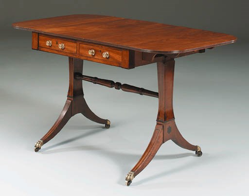 A REGENCY EBONY-INLAID MAHOGANY SOFA TABLE