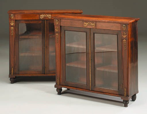 A PAIR OF REGENCY ORMOLU-MOUNTED ROSEWOOD SIDE CABINETS