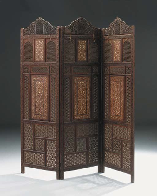 A KASHMIR IVORY AND BRASS INLAID CARVED AND OPENWORK THREE LEAF SCREEN