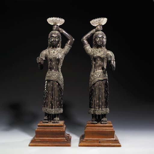A PAIR OF INDIAN REPOUSS SILVER LAMPS