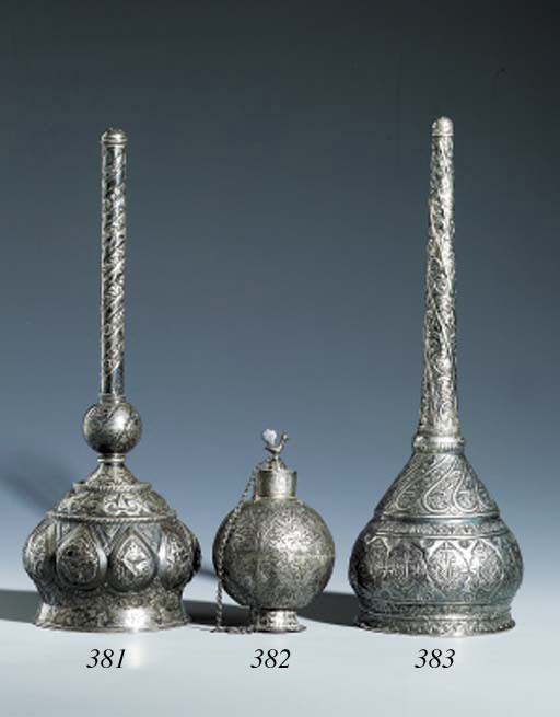 A SPHERICAL SILVER BOTTLE
