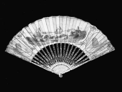 A rare printed fan, possibly Dutch, the paper leaf printed with a port scene possibly Marseilles in sepia and coloured by hand, the reserves painted with beehives and flowers, the ivory sticks carved and pierced with figures and decorated with coloured straw-work - 10in. (26cm.), circa 1775 (leaf worn and one stick and one guardstick repaired) - in 18th century English fan box