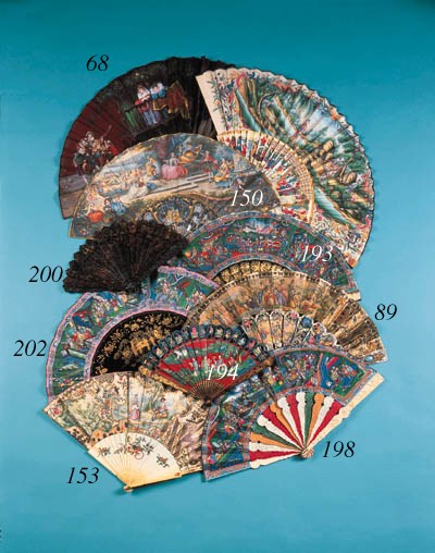 A Canton brise fan, lacquered in red, black, green, pink and blue with figures in a boat and a frieze of animals and flowers, the verso with figures in a garden - 8in. (20cm.), circa 1820 (slightly rubbed)