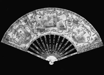 A fan, the silk leaf painted with an elegant lady at her toilette, the faces of painted ivory, the frames embroidered with gold thread and spangles, the ivory sticks carved, pierced and gilt with a couple dancing, the guardstick also both carved with the couple dancing - 11in. (28cm.), French, circa 1775 (folds strengthened at verso)