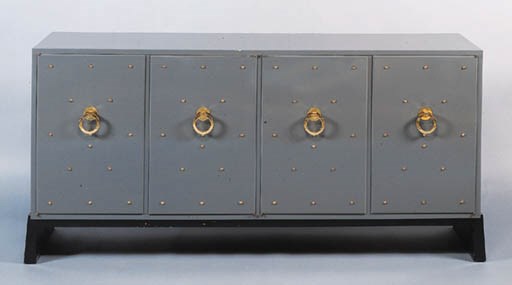 A BRASS-STUDDED LACQUER CABINET