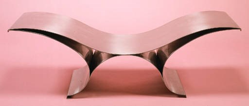 A BRUSHED-STEEL "WAVE" BENCH
