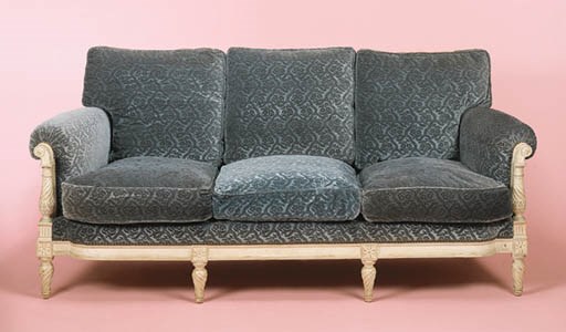 A LOUIS XVI STYLE PAINTED AND VELVET UPHOLSTERED SOFA