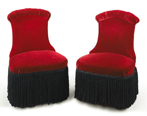 A PAIR OF UPHOLSTERED CONVERSATION CHAIRS