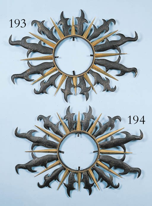 A PARCEL-GILT-METAL 'SUNBURST' MIRROR FRAME