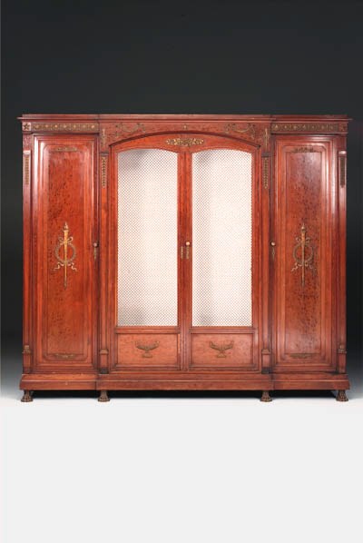 A French Empire style plum-pudding mahogany and ormolu-mounted bibliotheque, late 19th century