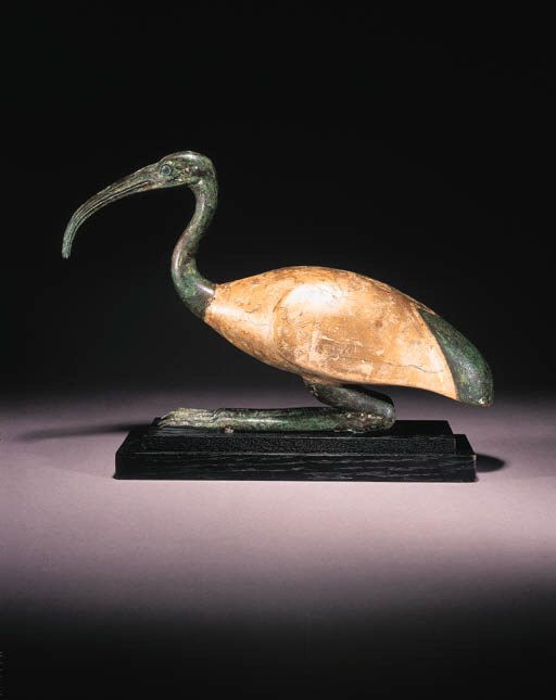 A LARGE GILDED WOOD AND BRONZE IBIS