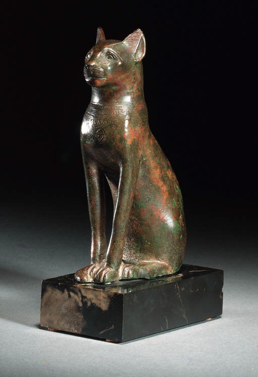 A BRONZE FIGURE OF A SEATED CAT
