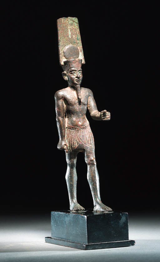 A BRONZE FIGURE OF THE GOD AMUN