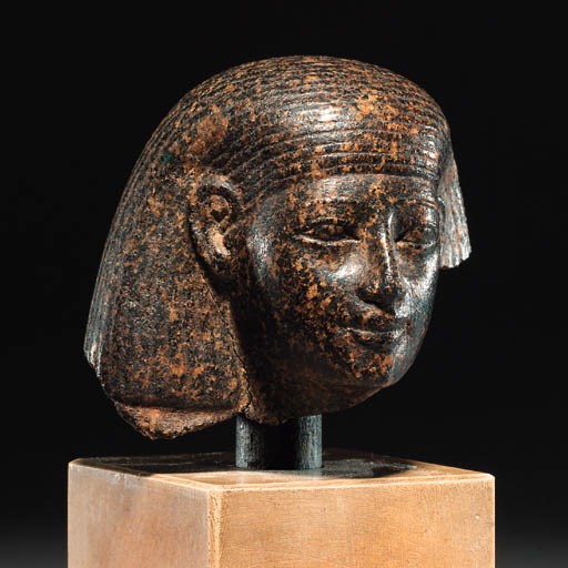 A GRANODIORITE PORTRAIT HEAD OF AN OFFICIAL