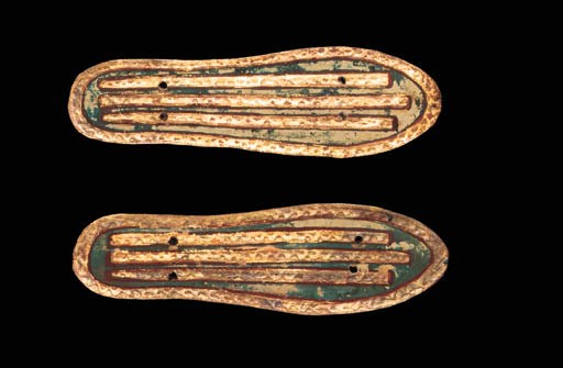 A PAIR OF GILDED AND GESSO-PAINTED LINEN SOLES