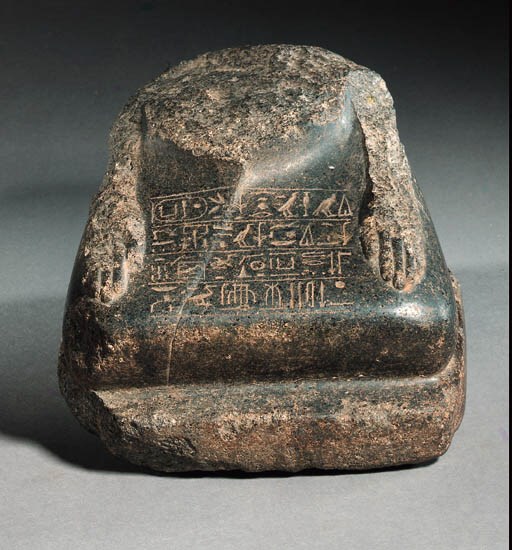 A MIDDLE KINGDOM FRAGMENTARY GRANITE BLOCK STATUE FOR THE VIZIER KHENEMES