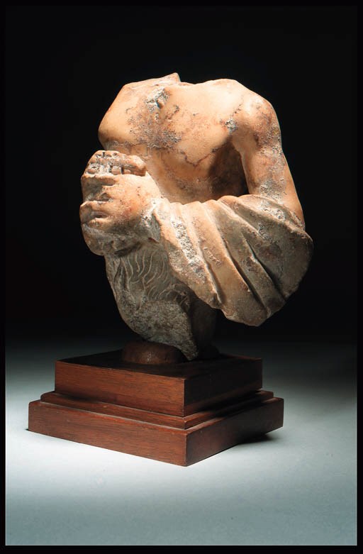 A ROMAN FRAGMENTARY MARBLE TORSO OF PAN