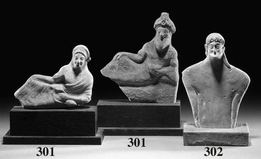 A MALE TERRACOTTA PLANK FIGURE