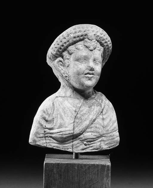 A TERRACOTTA BUST OF A YOUNG BOY